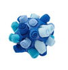 Ocean Blue dog sniffing puzzle ball